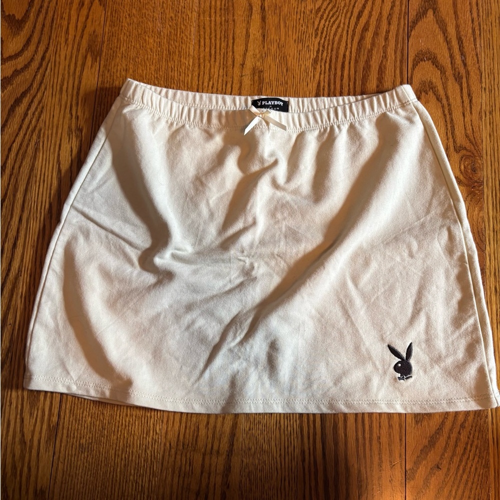 Tan Playboy miniskirt with bow.